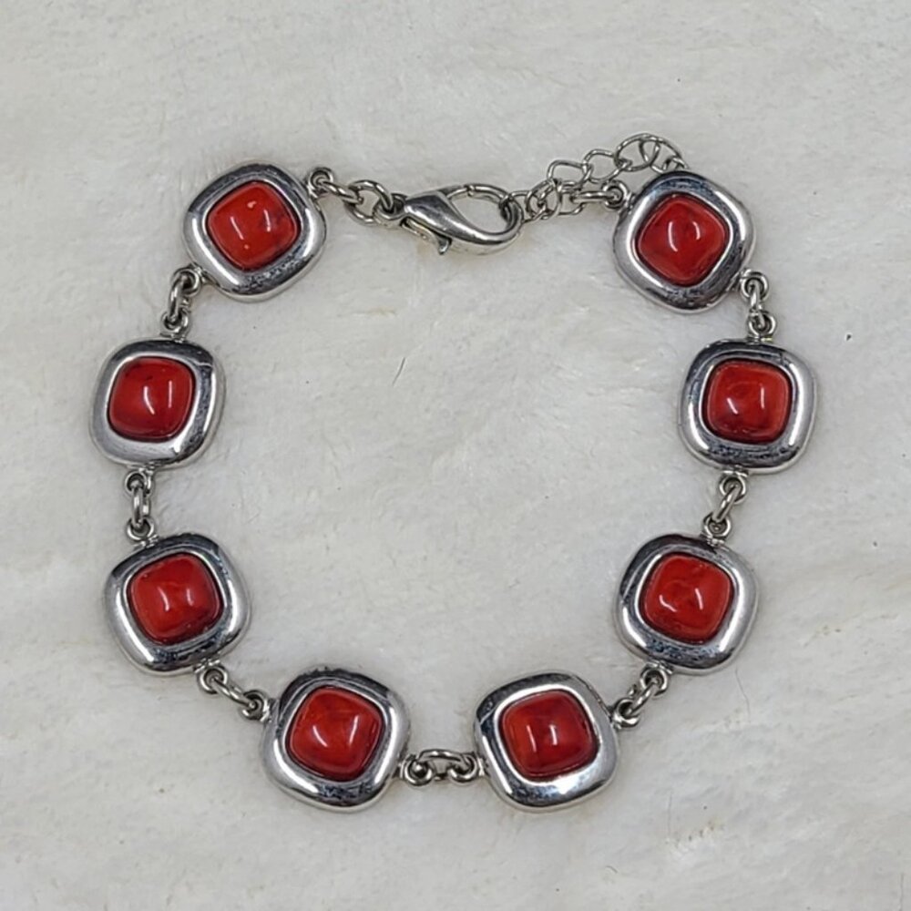Silver Tone Bracelet With Red Stones